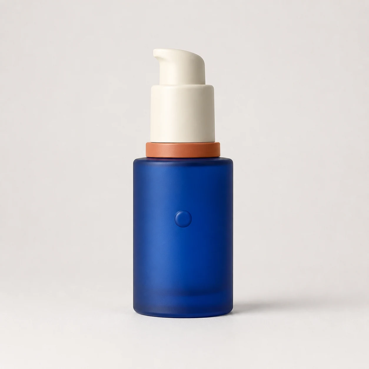 Fictional unbranded cobalt-blue serum bottle on a plain background used as the source product photo